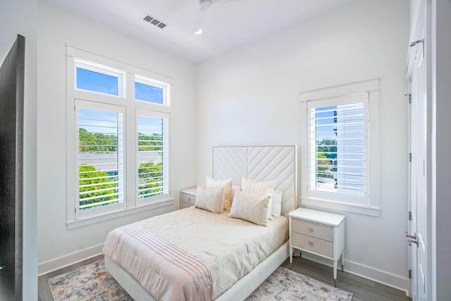 40 Cote D Azur Dr, Santa Rosa Beach, FL 32459 - bedroom with visible vents, multiple windows, wood finished floors, and baseboards