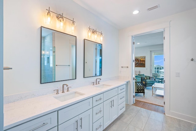 40 Cote D Azur Dr, Santa Rosa Beach, FL 32459 - bathroom with visible vents, tile patterned flooring, double vanity, and a sink