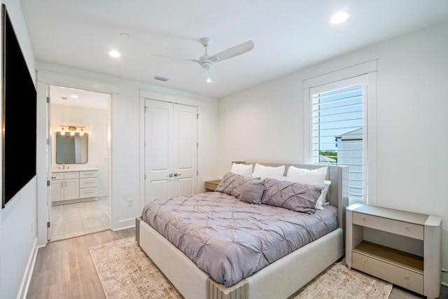 40 Cote D Azur Dr, Santa Rosa Beach, FL 32459 - bedroom featuring recessed lighting, connected bathroom, a closet, and light wood-style flooring