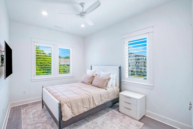 40 Cote D Azur Dr, Santa Rosa Beach, FL 32459 - bedroom featuring wood finished floors, baseboards, visible vents, and multiple windows