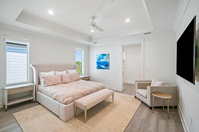 40 Cote D Azur Dr, Santa Rosa Beach, FL 32459 - bedroom featuring light wood finished floors, ceiling fan, a raised ceiling, visible vents, and baseboards