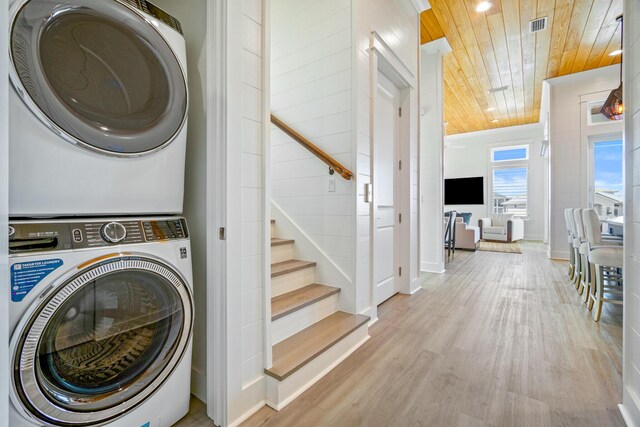 40 Cote D Azur Dr, Santa Rosa Beach, FL 32459 - washroom with wood ceiling, wood finished floors, stacked washer / drying machine, and visible vents