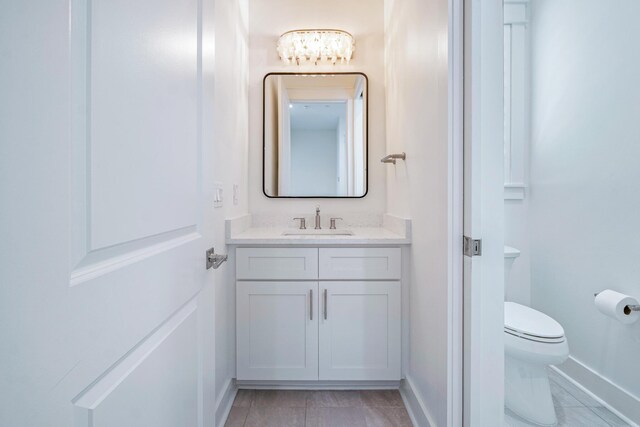 40 Cote D Azur Dr, Santa Rosa Beach, FL 32459 - half bathroom with vanity, toilet, tile patterned flooring, and baseboards