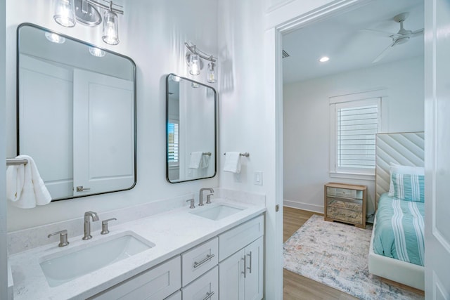 40 Cote D Azur Dr, Santa Rosa Beach, FL 32459 - full bath featuring double vanity, wood finished floors, a ceiling fan, and a sink