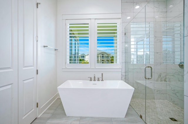 40 Cote D Azur Dr, Santa Rosa Beach, FL 32459 - bathroom featuring a freestanding tub, a stall shower, and baseboards