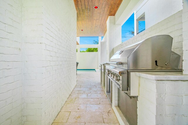40 Cote D Azur Dr, Santa Rosa Beach, FL 32459 - view of patio with area for grilling and an outdoor kitchen