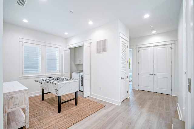 40 Cote D Azur Dr, Santa Rosa Beach, FL 32459 - rec room with baseboards, visible vents, washer / dryer, and light wood-style flooring