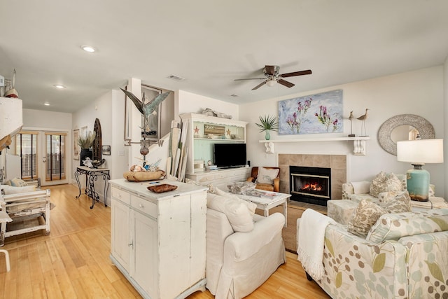 16 Kingfish St, Santa Rosa Beach, FL 32459 - living area featuring a ceiling fan, a tiled fireplace, light wood-style flooring, and recessed lighting