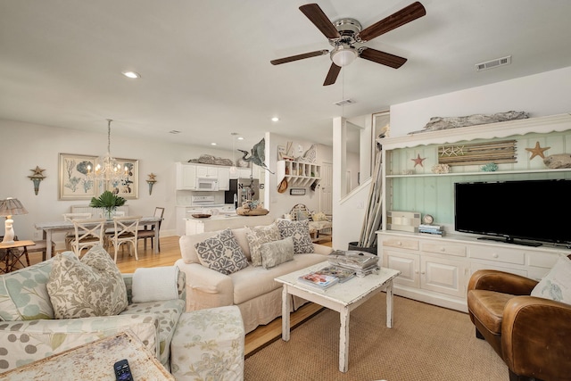 16 Kingfish St, Santa Rosa Beach, FL 32459 - living area with light wood finished floors, a ceiling fan, a chandelier, and recessed lighting