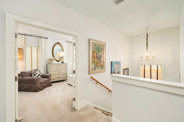 16 Kingfish St, Santa Rosa Beach, FL 32459 - hallway with carpet floors, a chandelier, an upstairs landing, and baseboards