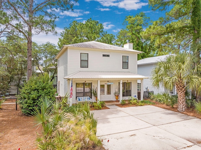 16 Kingfish St, Santa Rosa Beach, FL 32459 - american foursquare style home featuring a chimney, a porch, and metal roof