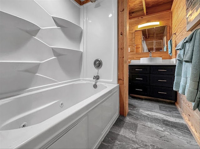 178 Osage Dr, Defuniak Springs, FL 32433 - full bathroom featuring wooden walls, a combined bath / shower with jetted tub, and vanity