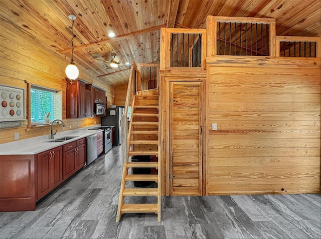 178 Osage Dr, Defuniak Springs, FL 32433 - kitchen with a sink, wooden walls, wooden ceiling, lofted ceiling, and appliances with stainless steel finishes