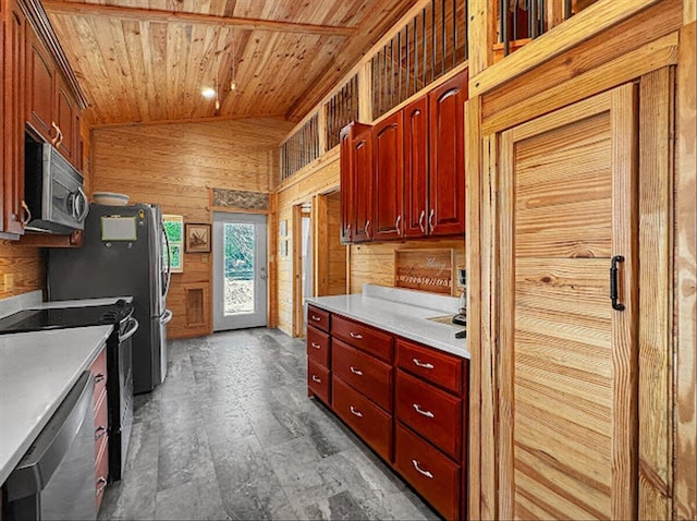 178 Osage Dr, Defuniak Springs, FL 32433 - kitchen with stainless steel appliances, wooden ceiling, wood walls, and light countertops