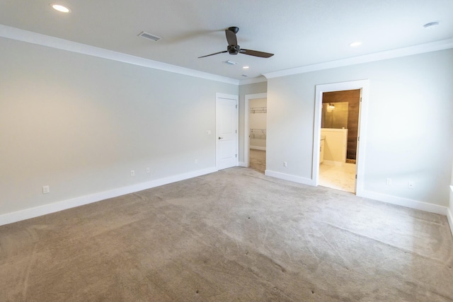 unfurnished bedroom featuring recessed lighting, carpet, visible vents, ornamental molding, and baseboards