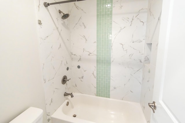 full bathroom featuring washtub / shower combination and toilet
