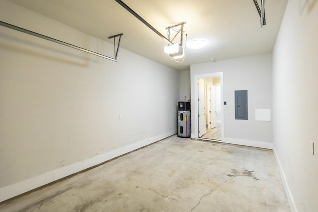 garage with heat pump water heater, electric panel, baseboards, and a garage door opener