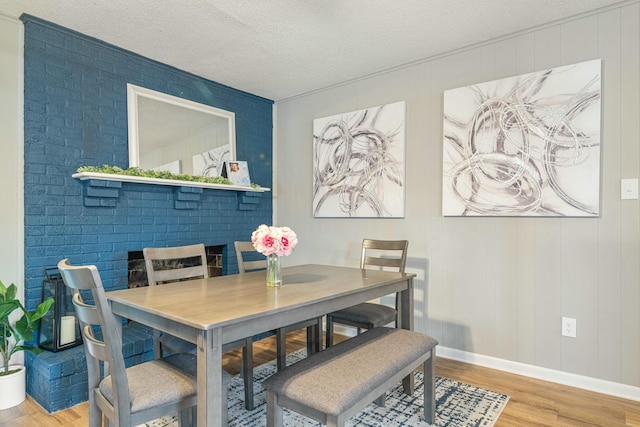 1017 Revere Dr, Pensacola, FL 32505 - dining room with baseboards, wood finished floors, and a textured ceiling