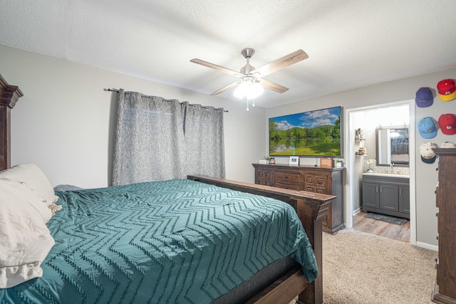 1017 Revere Dr, Pensacola, FL 32505 - bedroom with a ceiling fan, a sink, light colored carpet, and ensuite bath