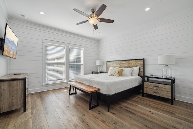 116 Riviera Dr, Panama City Beach, FL 32413 - bedroom featuring hardwood / wood-style flooring, wooden walls, recessed lighting, and crown molding