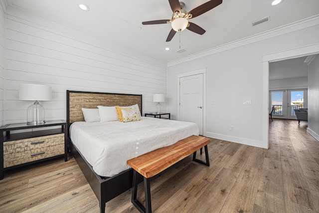 116 Riviera Dr, Panama City Beach, FL 32413 - bedroom featuring wood-type flooring, french doors, recessed lighting, and crown molding