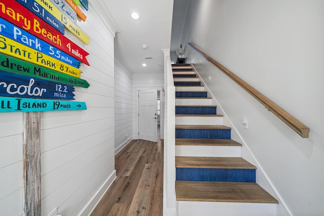 116 Riviera Dr, Panama City Beach, FL 32413 - staircase with wood finished floors, wooden walls, and recessed lighting