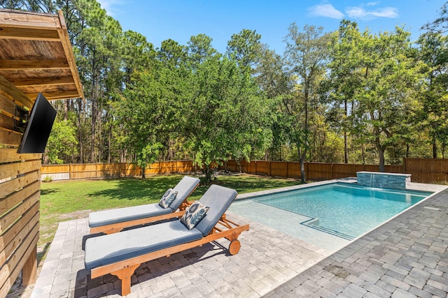 view of pool with a lawn, a fenced in pool, a patio, and a fenced backyard