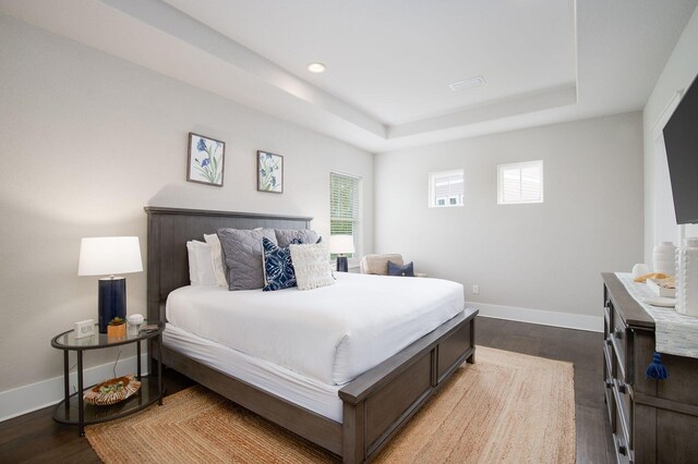 374 Gulfview Cir, Santa Rosa Beach, FL 32459 - bedroom featuring recessed lighting, baseboards, a raised ceiling, and dark wood finished floors