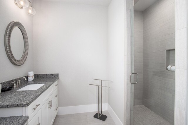 374 Gulfview Cir, Santa Rosa Beach, FL 32459 - full bath with vanity, tile patterned flooring, a stall shower, and baseboards