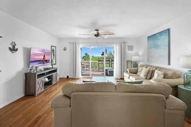 8522 Gulf Blvd Unit 20, Navarre, FL 32566 - living room featuring light wood finished floors, baseboards, and a ceiling fan
