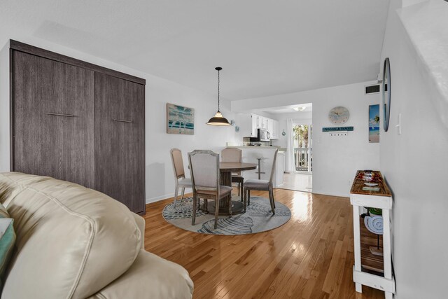 8522 Gulf Blvd Unit 20, Navarre, FL 32566 - dining space featuring visible vents and light wood finished floors