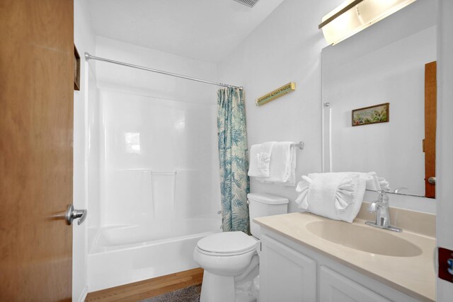 8522 Gulf Blvd Unit 20, Navarre, FL 32566 - bathroom with shower / bath combo, wood finished floors, vanity, toilet, and visible vents