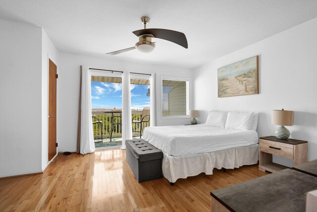 8522 Gulf Blvd Unit 20, Navarre, FL 32566 - bedroom with ceiling fan, access to outside, and light wood-style flooring