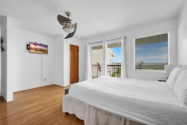 8522 Gulf Blvd Unit 20, Navarre, FL 32566 - bedroom featuring light wood-style floors, ceiling fan, and access to outside
