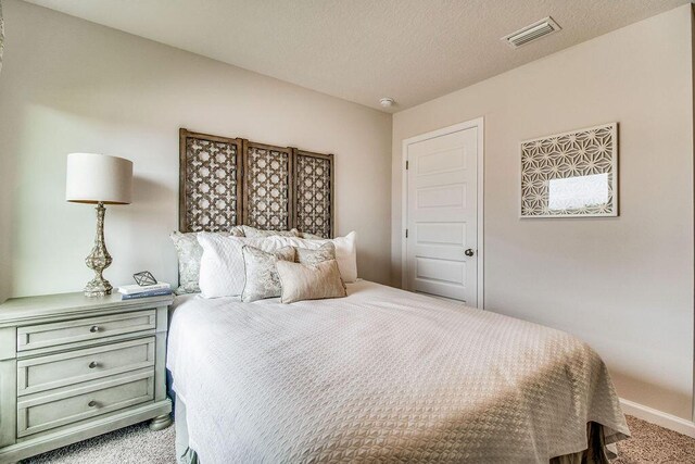 8760 Bluebell St, Milton, FL 32583 - carpeted bedroom with baseboards and visible vents
