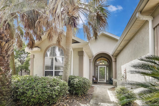226 Talquin Cv, Destin, FL 32541 - view of exterior entry featuring stucco siding