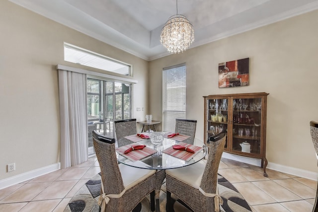 226 Talquin Cv, Destin, FL 32541 - dining area featuring a raised ceiling, a chandelier, baseboards, light tile patterned floors, and ornamental molding