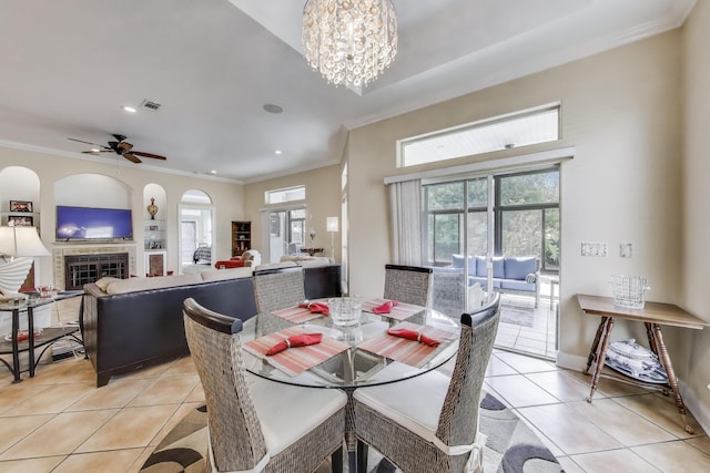 226 Talquin Cv, Destin, FL 32541 - dining area with crown molding, visible vents, a fireplace, recessed lighting, and light tile patterned floors