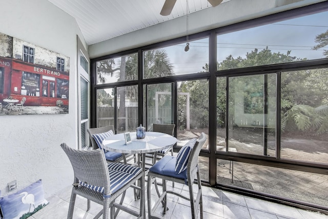 226 Talquin Cv, Destin, FL 32541 - sunroom featuring tile patterned flooring, a textured wall, a ceiling fan, and outdoor dining space