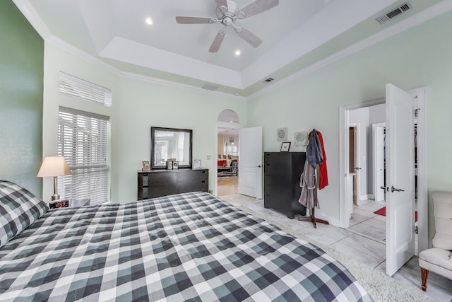 226 Talquin Cv, Destin, FL 32541 - bedroom featuring visible vents, ornamental molding, a raised ceiling, and arched walkways