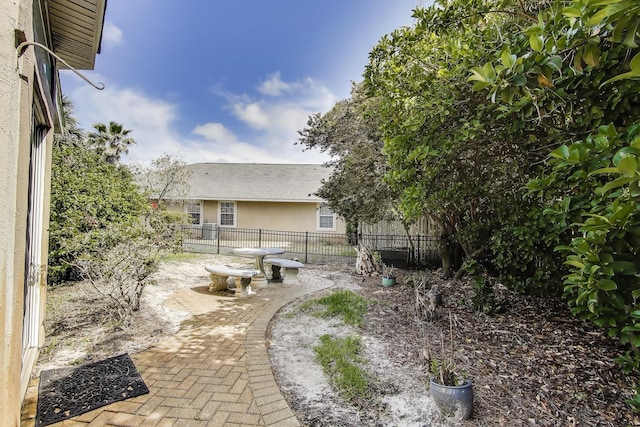 226 Talquin Cv, Destin, FL 32541 - view of yard featuring a patio and fence