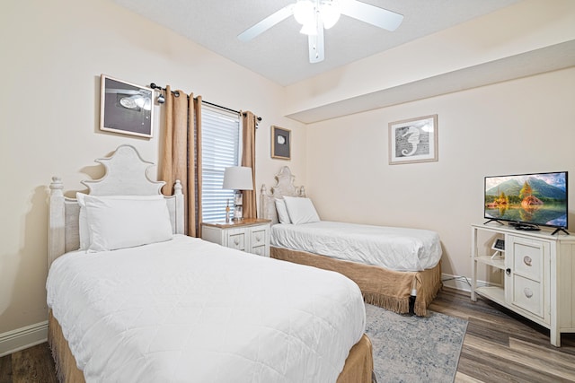 112 Seascape Dr Unit 707, Miramar Beach, FL 32550 - bedroom with wood finished floors, a ceiling fan, and baseboards