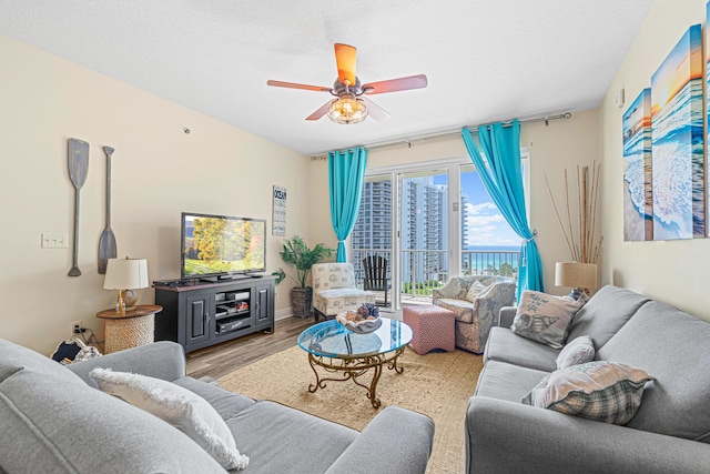 112 Seascape Dr Unit 707, Miramar Beach, FL 32550 - living area with ceiling fan and wood finished floors