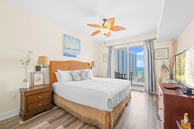 112 Seascape Dr Unit 707, Miramar Beach, FL 32550 - bedroom with wood finished floors, access to outside, and multiple windows