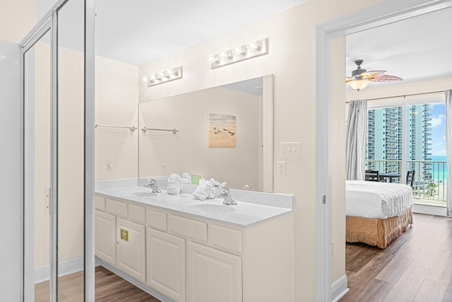 112 Seascape Dr Unit 707, Miramar Beach, FL 32550 - full bath with double vanity, wood finished floors, ensuite bathroom, and a sink