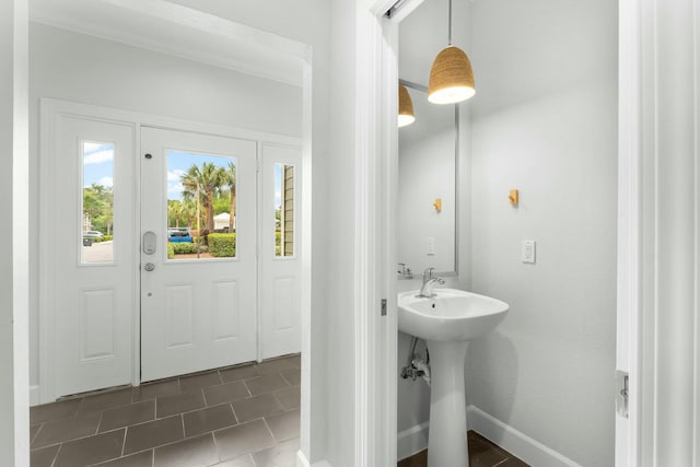 bathroom with tile patterned floors and a sink