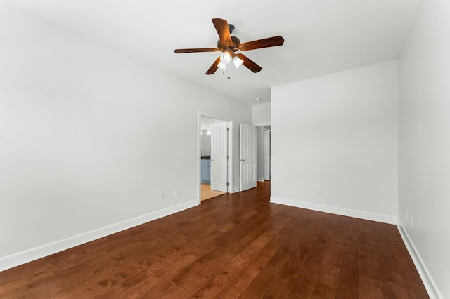 unfurnished bedroom with dark wood-style flooring, ceiling fan, and baseboards