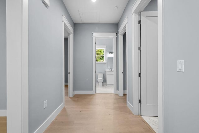 42 Central 8th St, Santa Rosa Beach, FL 32459 - hallway featuring baseboards and light wood-type flooring