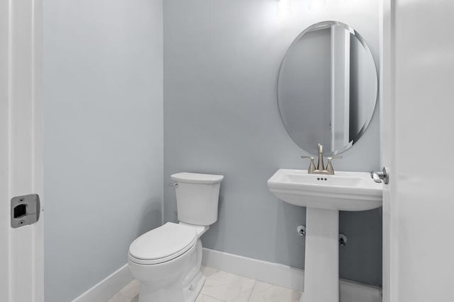 42 Central 8th St, Santa Rosa Beach, FL 32459 - bathroom with toilet, baseboards, and marble finish floor
