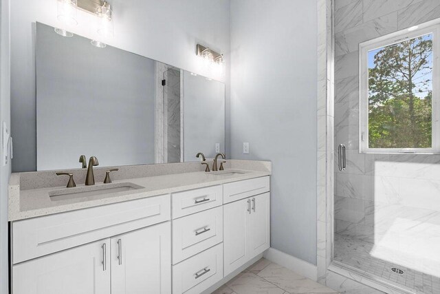 42 Central 8th St, Santa Rosa Beach, FL 32459 - full bathroom with double vanity, a marble finish shower, a sink, and marble finish floor